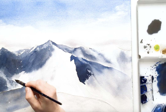 Painting snowy mountains with watercolor