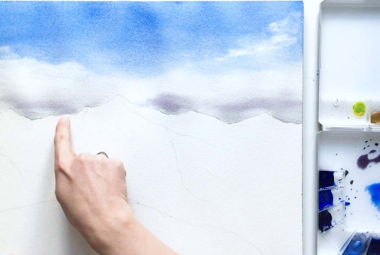 Painting snowy mountains with watercolor