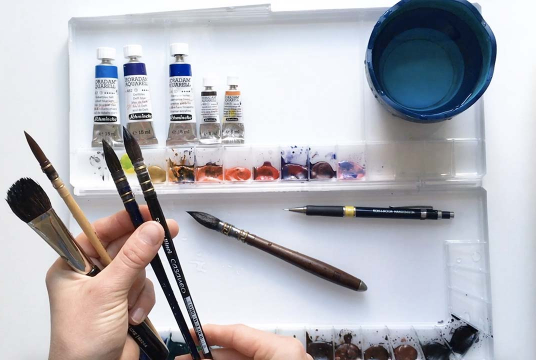 Painting snowy mountains with watercolor